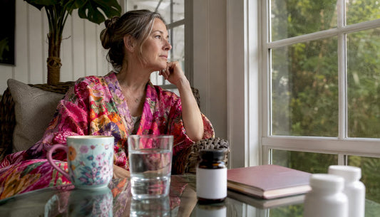 Menopausal woman taking jet lag supplements at home