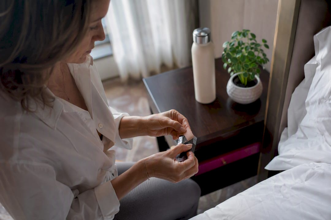 Woman peeling energy oral strip