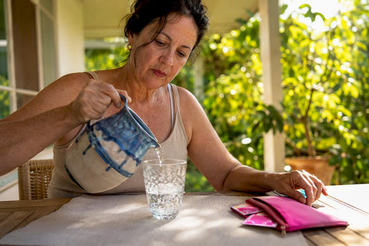 Woman pouring water after hot flash