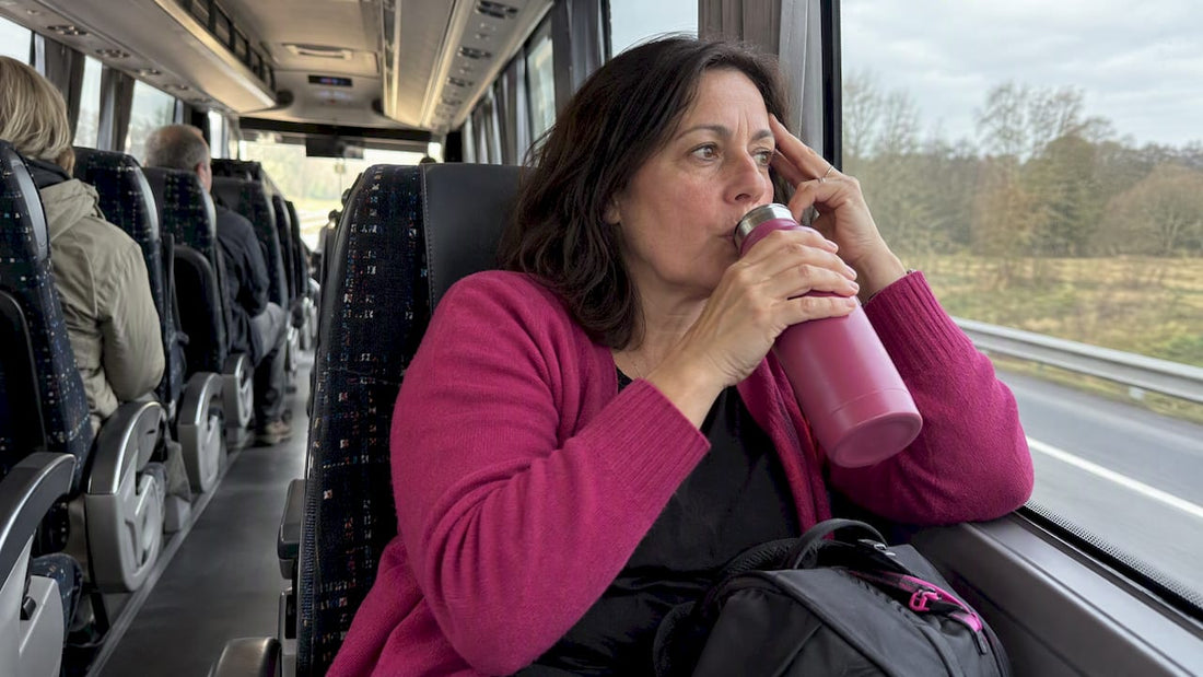 Traveler sipping water during a headache
