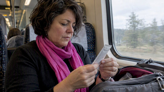 Traveler checking an electrolyte sachet ingredient panel