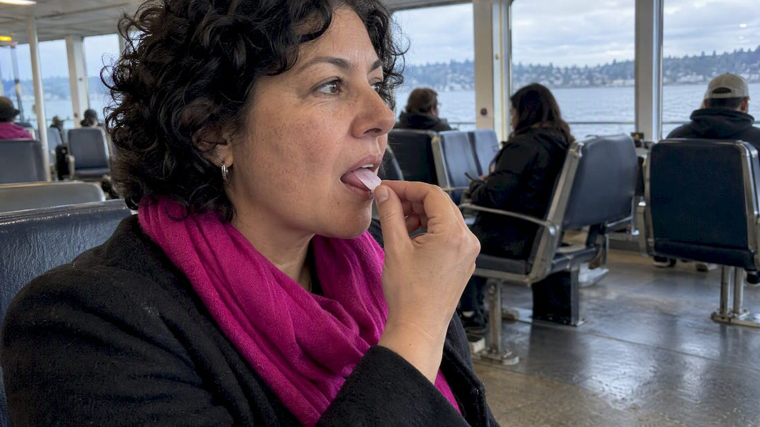 Midlife traveler taking a dissolving oral strip